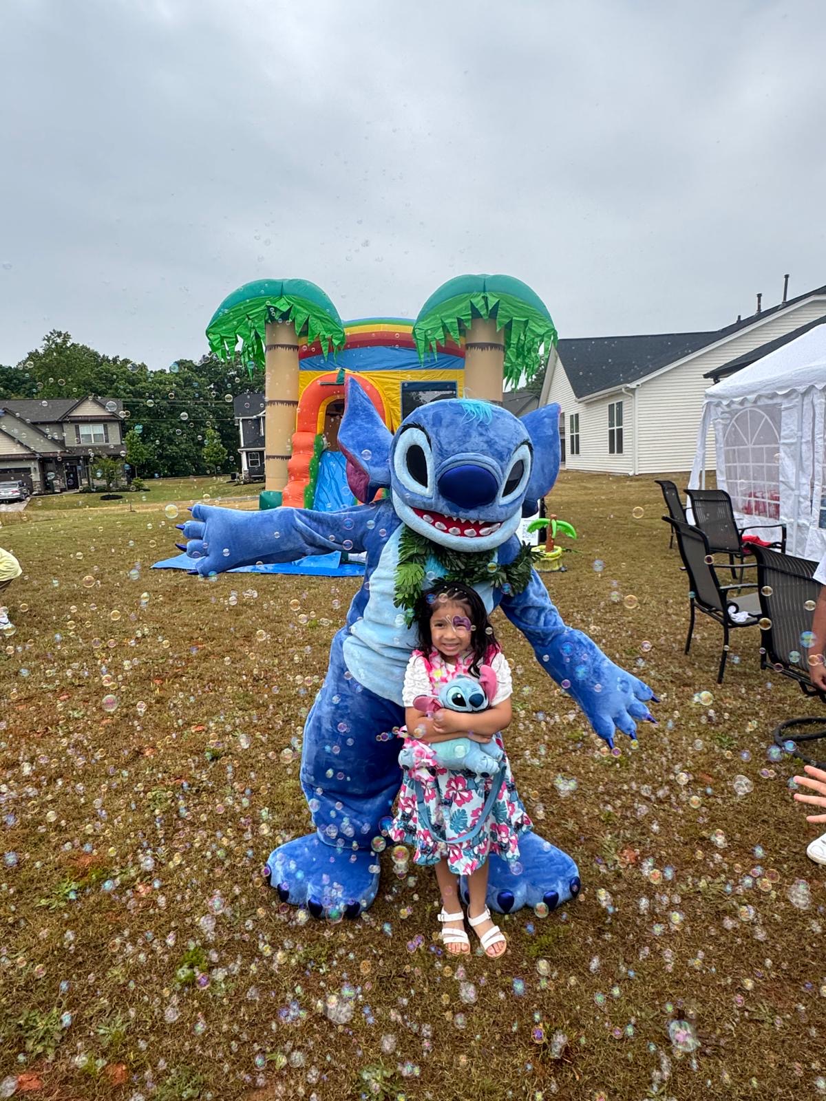 KL Parties Stitch performer with a child at an outdoor birthday party