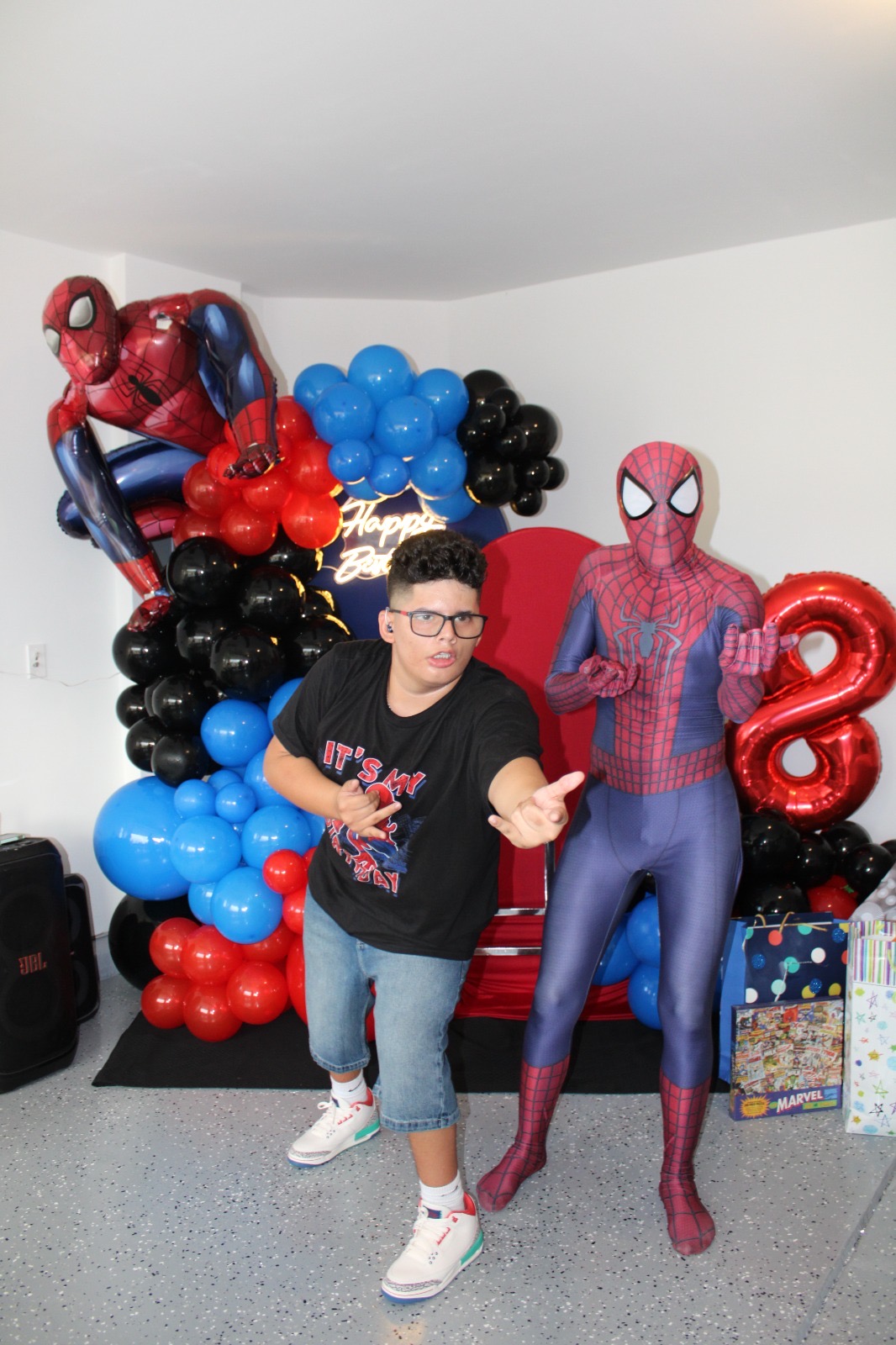 KL Parties Spider-Man performer with a child at a birthday celebration